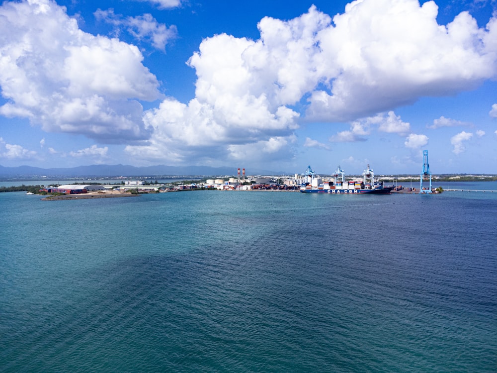 a large body of water with a city in the background