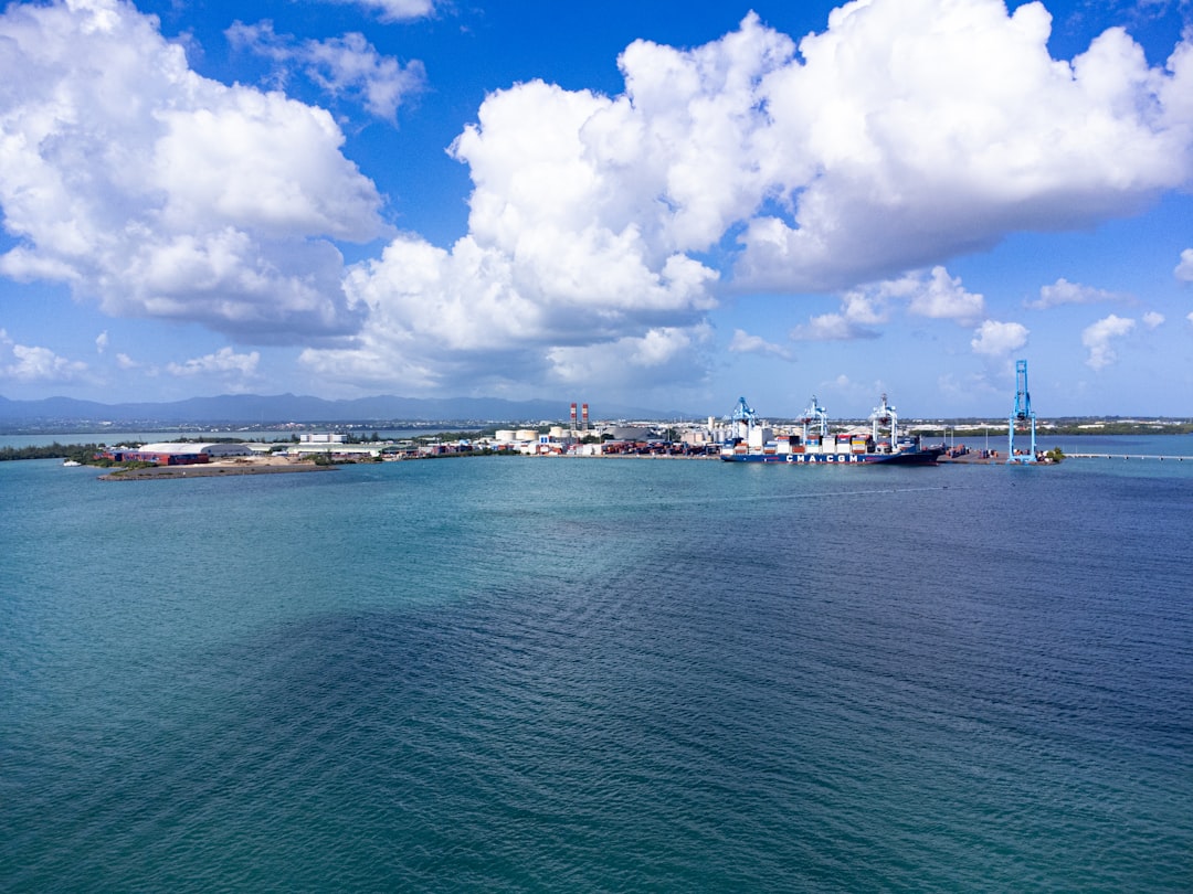 a large body of water with a city in the background,