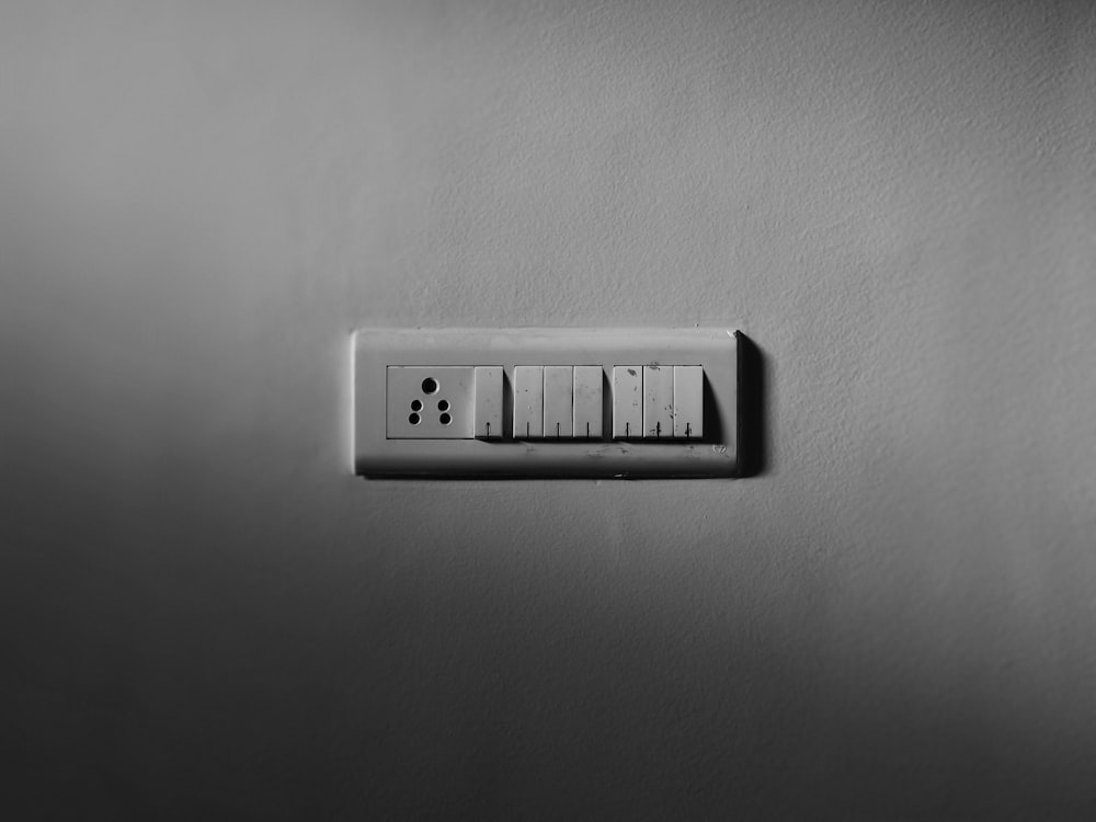 a black and white photo of a light switch
