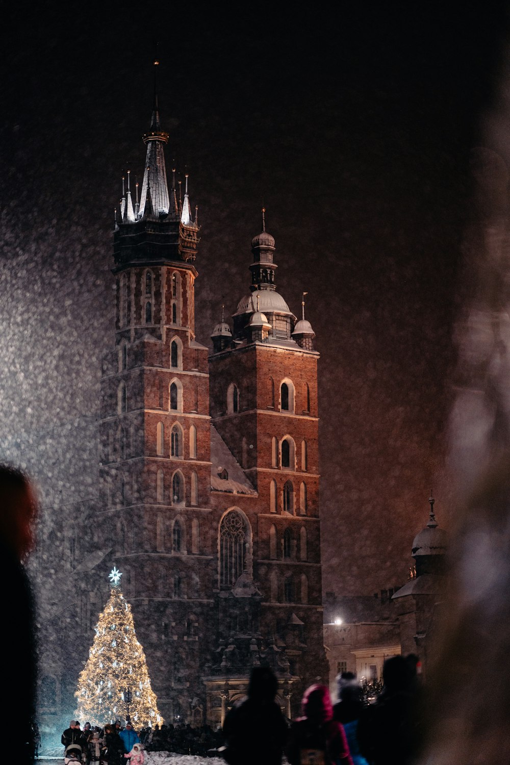 a large building with a christmas tree in front of it