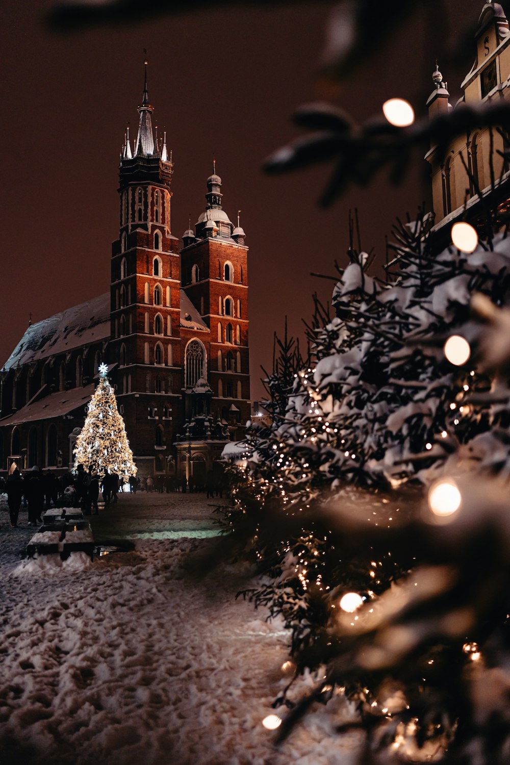 a christmas tree in front of a large building