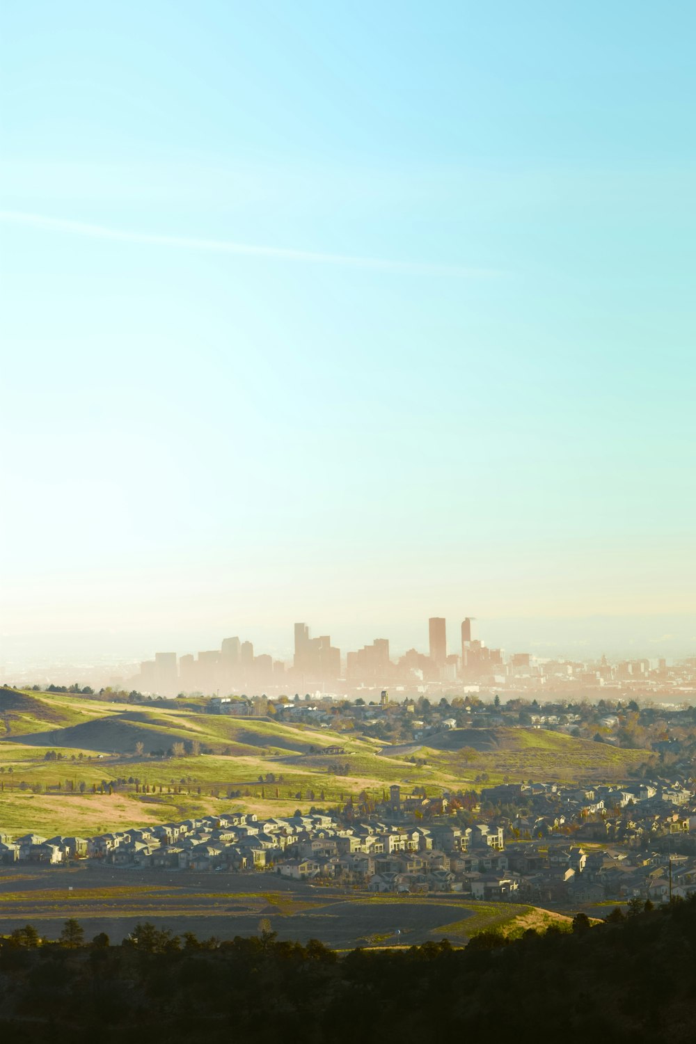 a view of a city from a hill