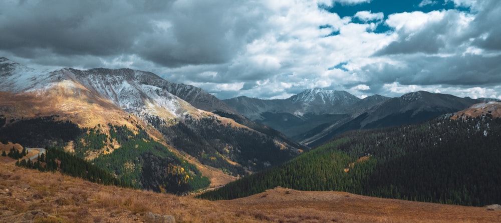 a view of a mountain range with a cloudy sky