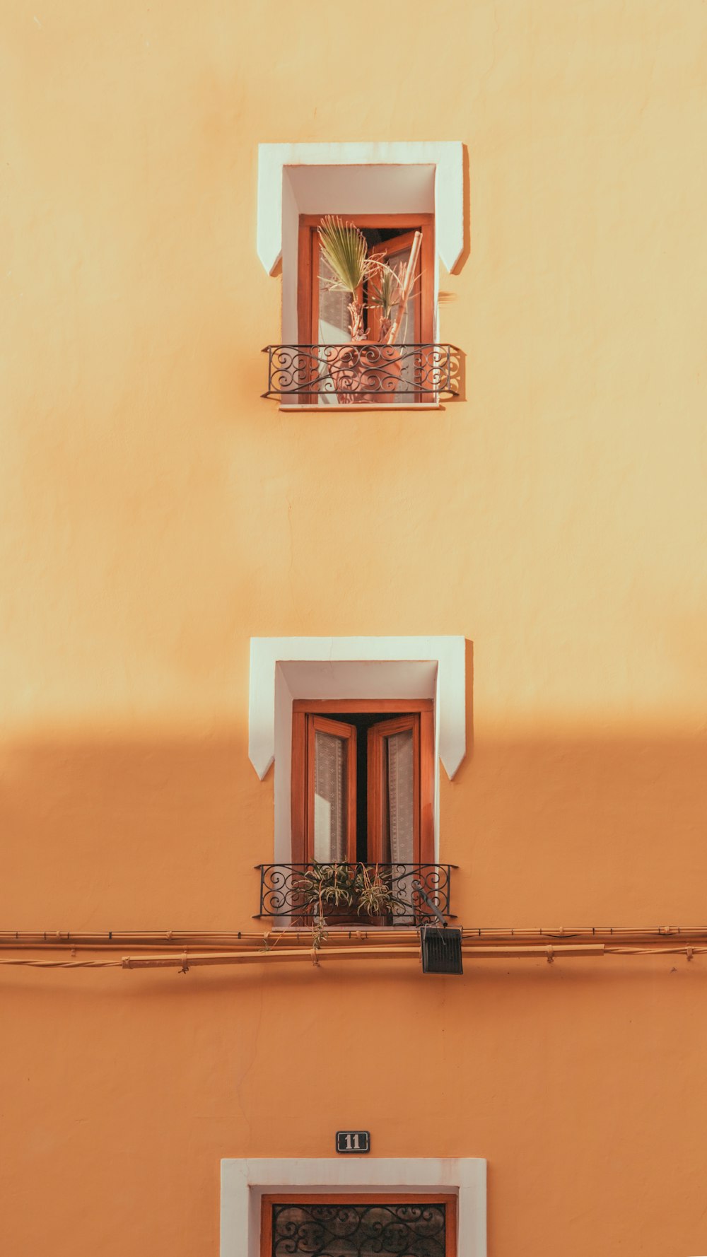 a building with two balconies and a balcony