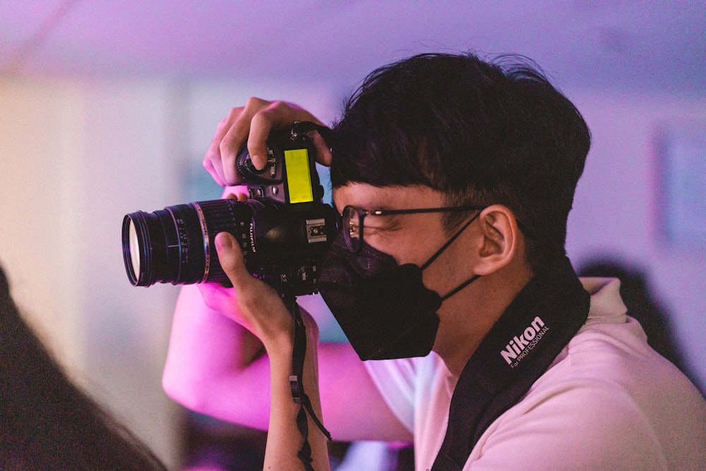 a man taking a picture with a camera