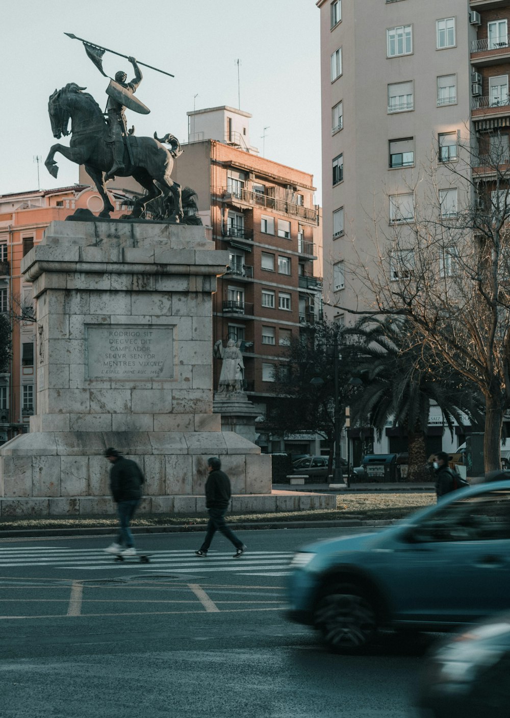 a statue of a man on a horse on a city street