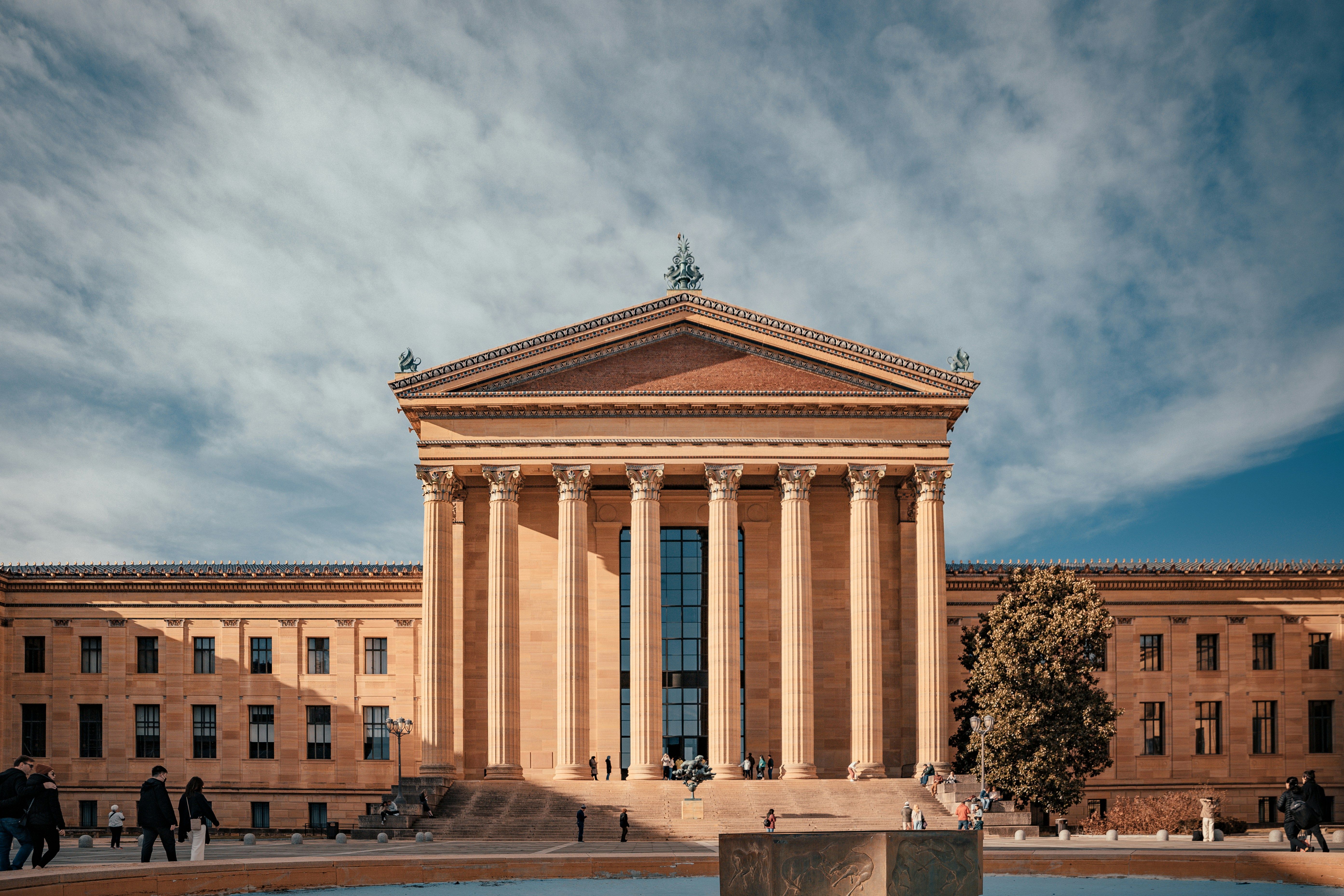 a large building with a fountain in front of it