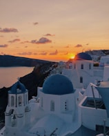 A picturesque sunset over the caldera in Santorini.