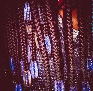 Close-up of intricate cornrows with colorful beads woven in