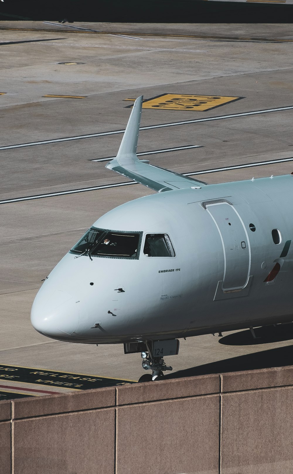 a large jetliner sitting on top of an airport tarmac