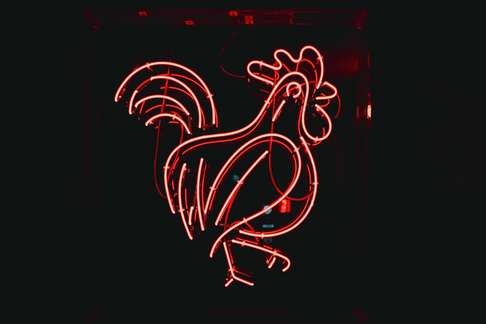 a neon sign with a rooster on it