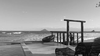 A serene beach house with ocean views and a wooden deck.