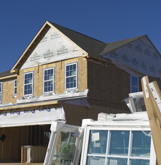 a house under construction with the roof ripped off