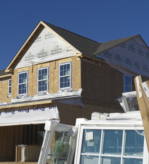 a house under construction with the roof ripped off