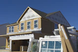 Interior view of a home addition with framing and drywall in progress.