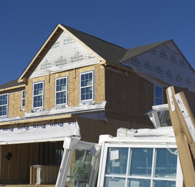 a house under construction with the roof ripped off