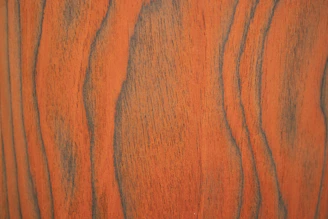 Close-up of a rich brown Indonesian teak cutting board showcasing its smooth grain and natural finish.