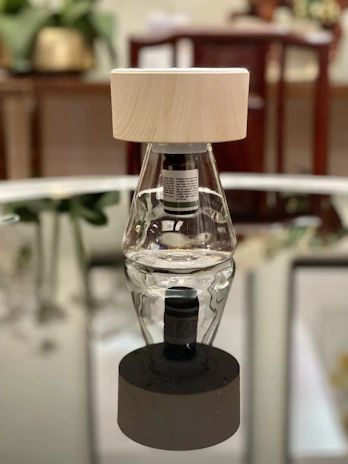 Contemporary product displayed with subtle reflections on a glass table