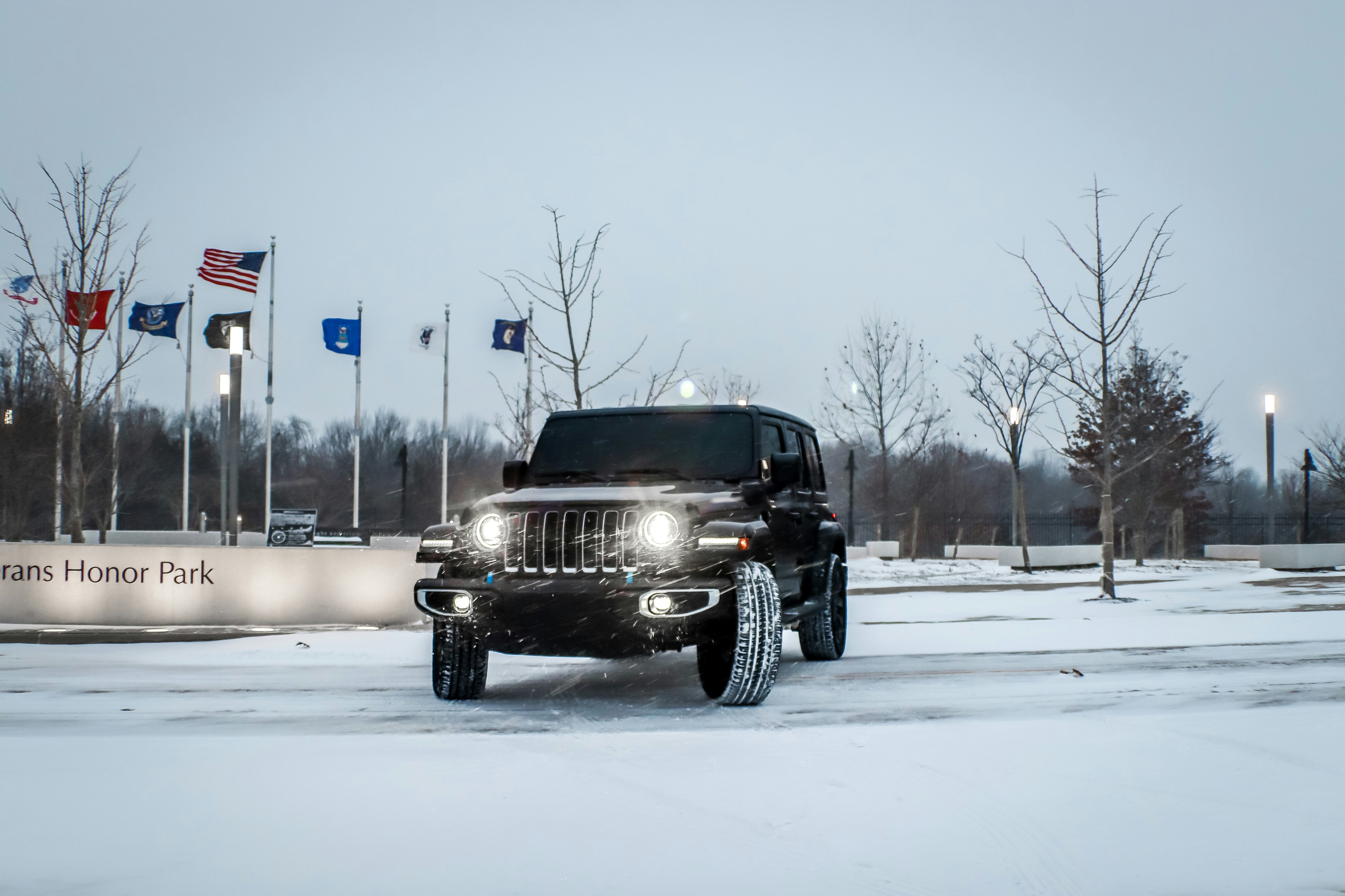 Black Jeep drifting in snow