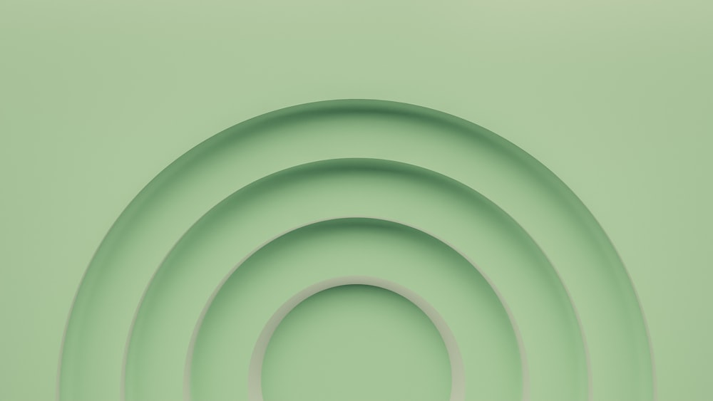 a green background with a circular design in the center