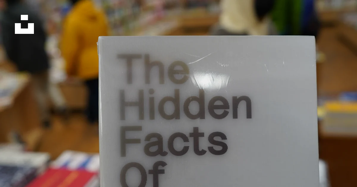 A person holding up a sign in a store photo – Free Usa Image on Unsplash