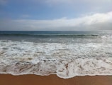 A tranquil scene of waves gently lapping at the shore.