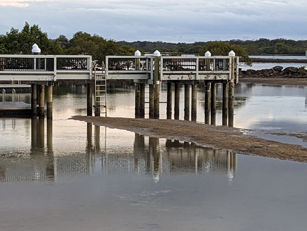 a pier with a boat in the water