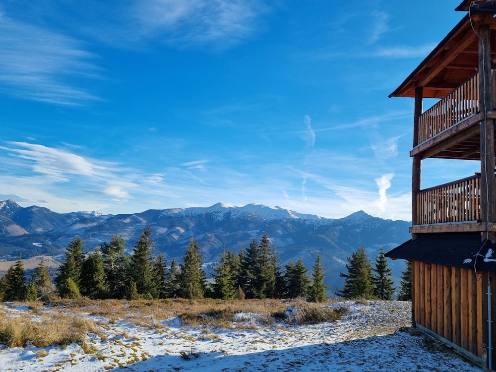 a view of a mountain range from a cabin