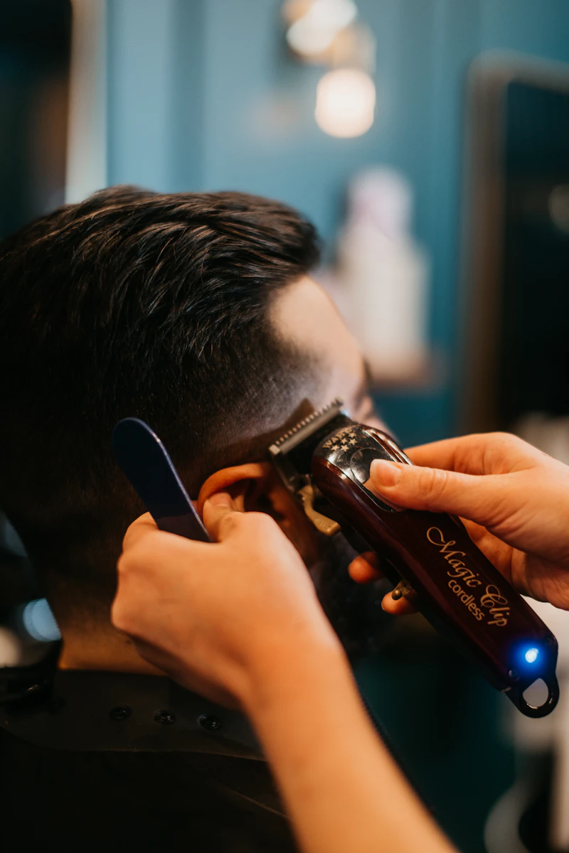 Clippers working a tight skin fade