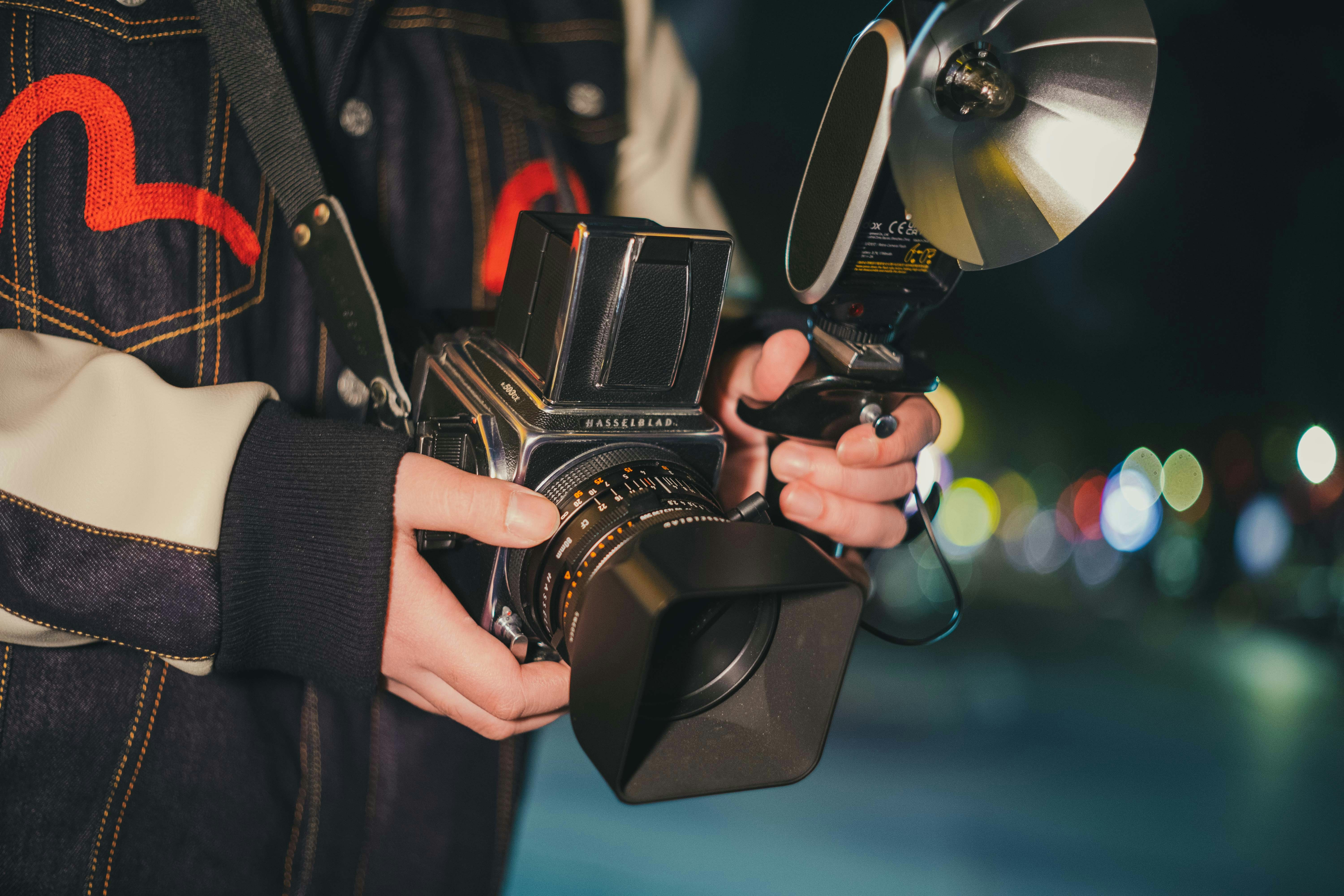 a person holding a camera in their hands