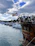 A group of young sailors laughing and preparing their boat on a sunny Croatian marina.