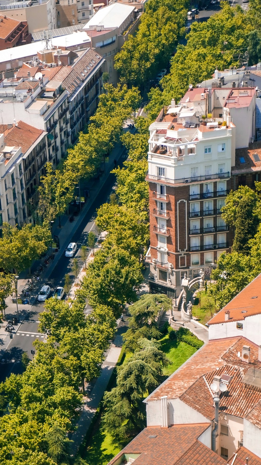 an aerial view of a city with lots of trees