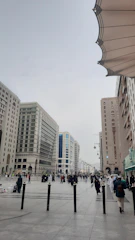 A team conducting a public opinion survey in a busy urban plaza.
