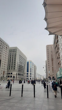 A team conducting a public opinion survey in a busy urban plaza.