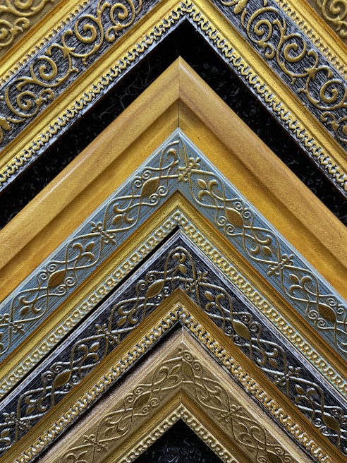 A set of hand-cut wooden picture frames showcasing precise miters and veneering