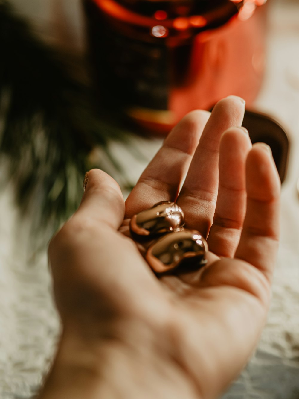 a person holding two rings in their hand