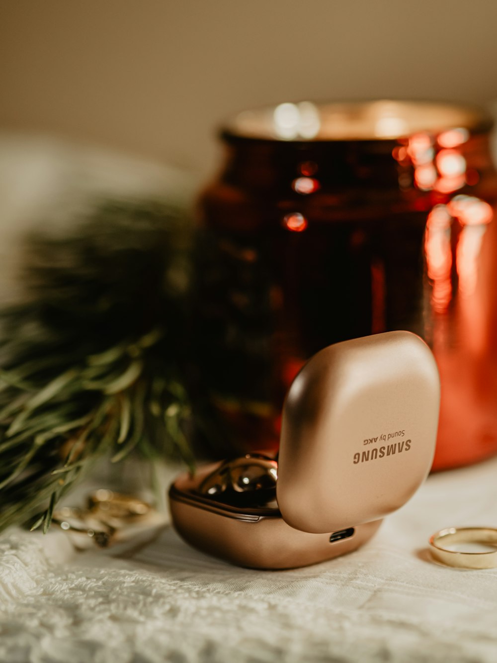 a couple of gold rings sitting on top of a table