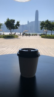 Guests enjoying a peaceful morning coffee on a balcony overlooking the city skyline