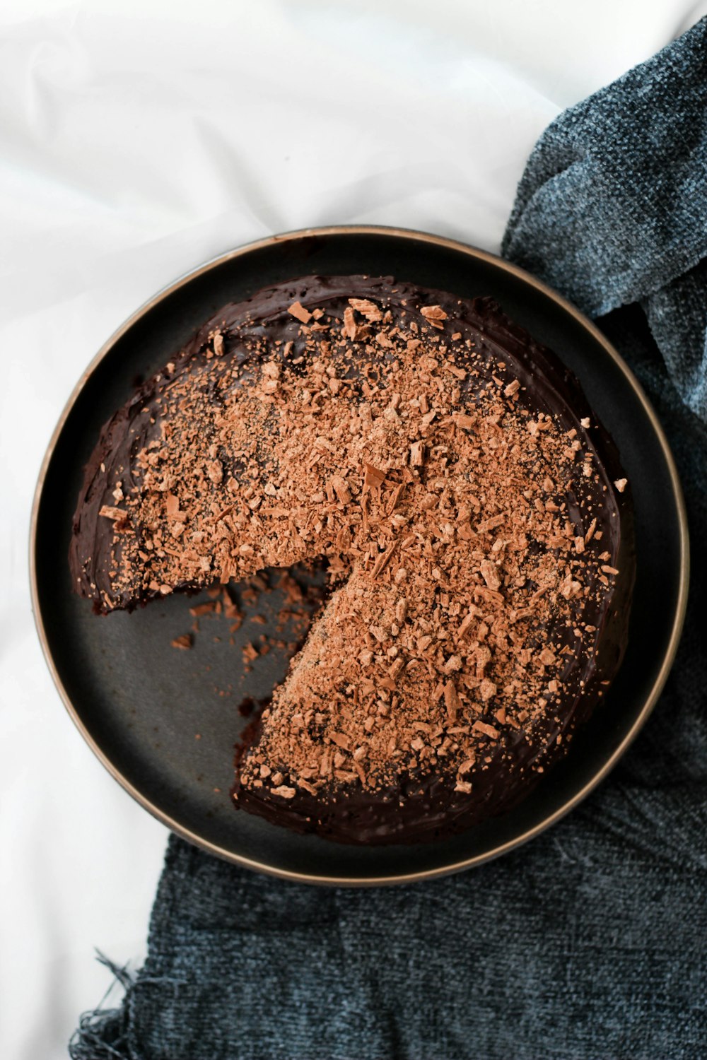 a chocolate cake with a slice taken out of it