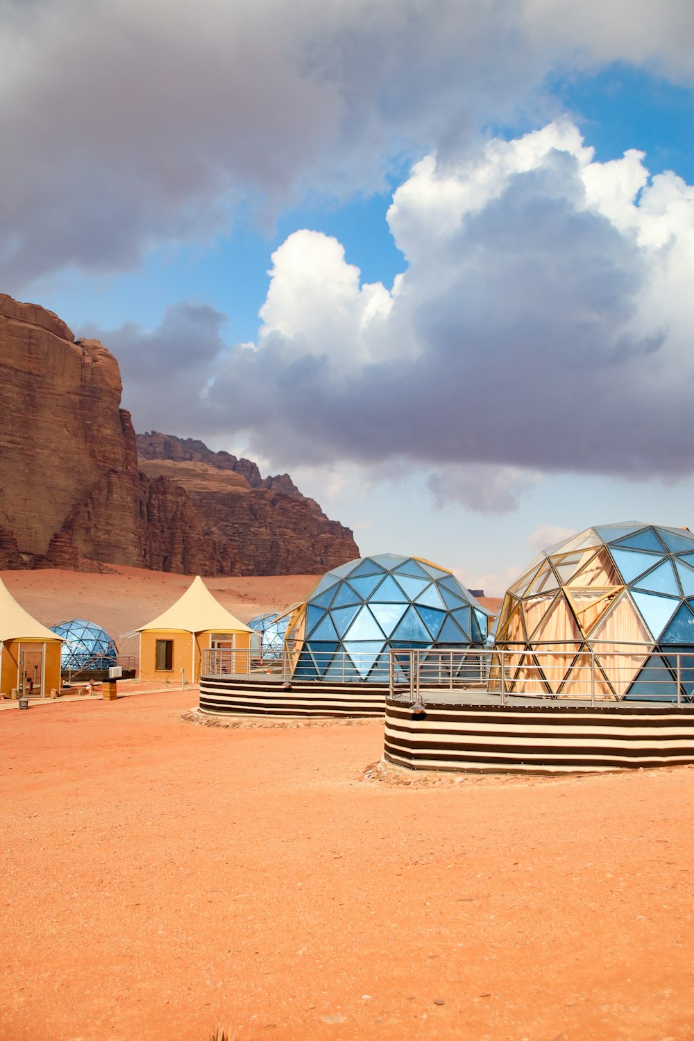 a group of domes sitting in the middle of a desert