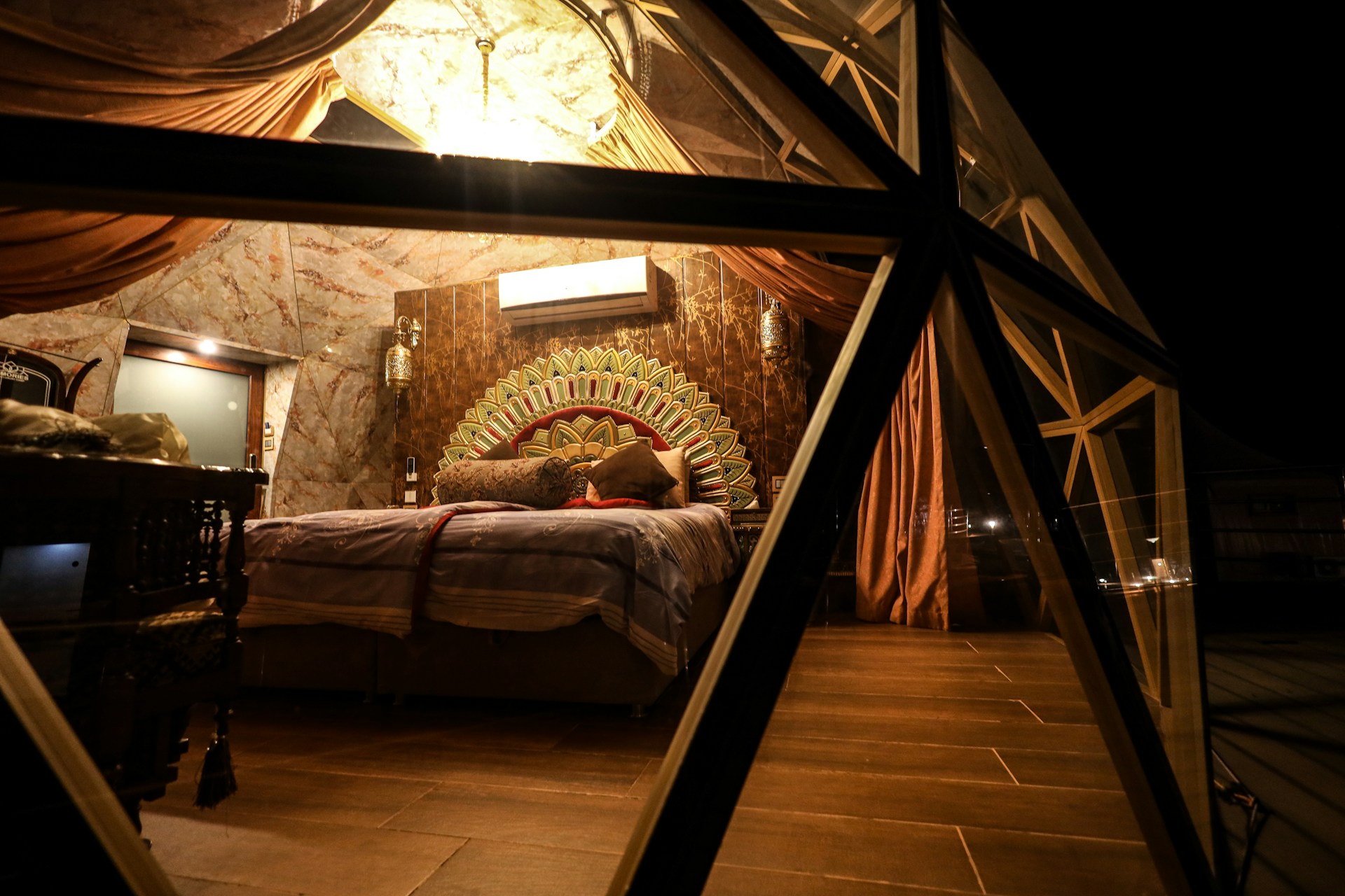 A cozy bedroom in a Dubai villa featuring elegant decor and soft lighting.