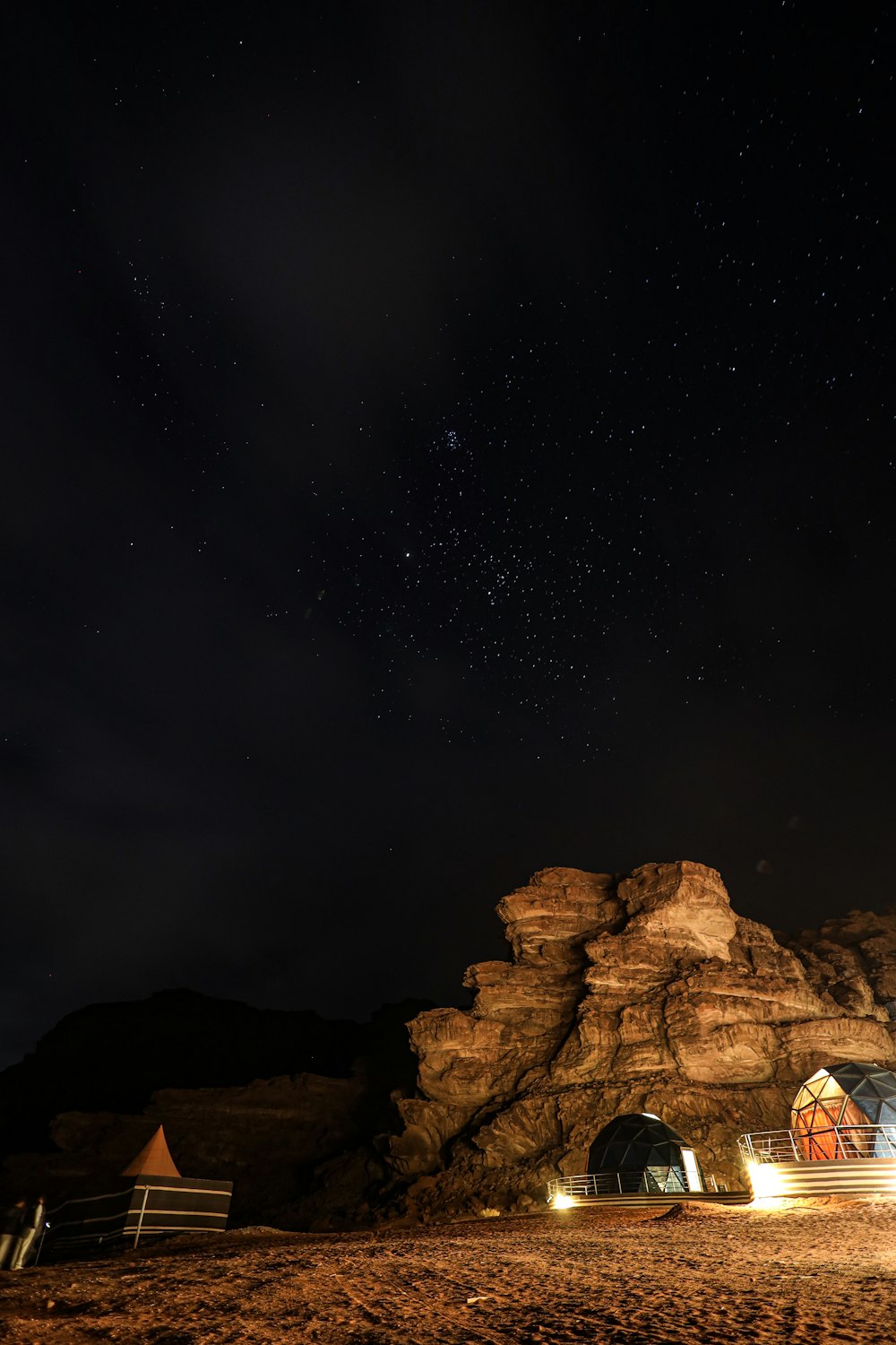 a night time scene of a rocky mountain