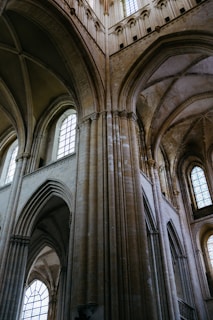 the interior of a large cathedral with many windows