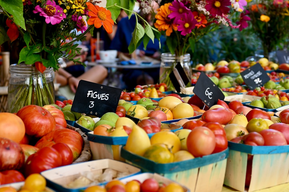 a bunch of baskets filled with lots of fruit