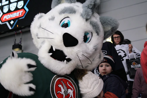 A custom mascot costume shaped like a friendly cartoon lion, ready for events.