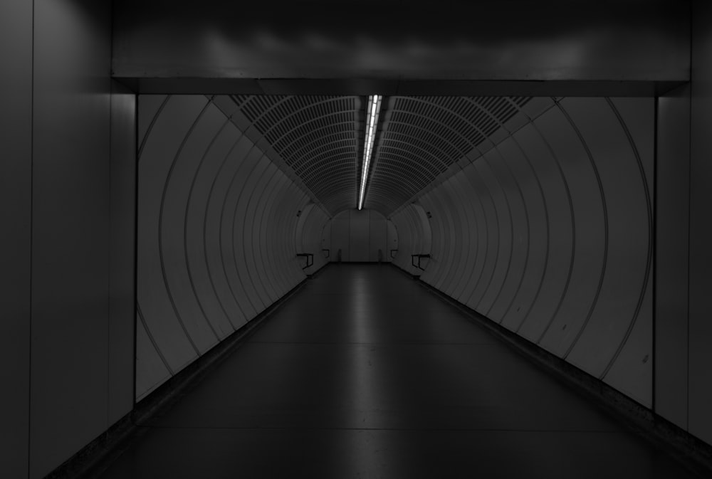 a long tunnel with a long walkway going through it
