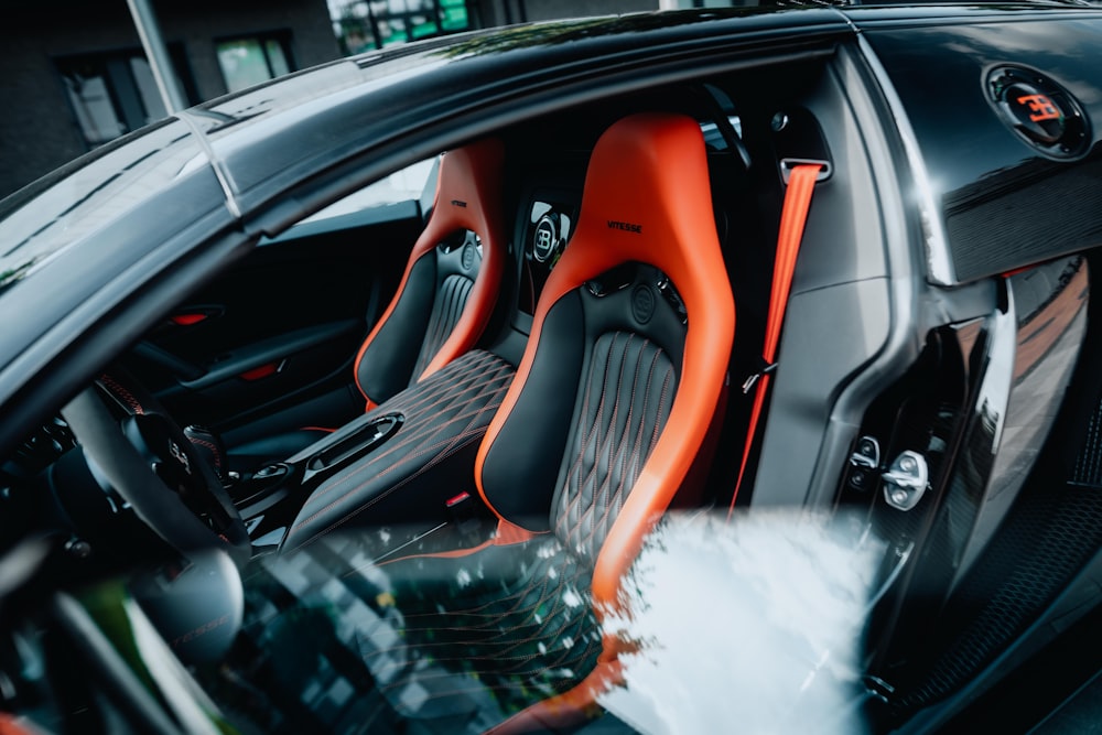 a close up of a car's interior with the door open