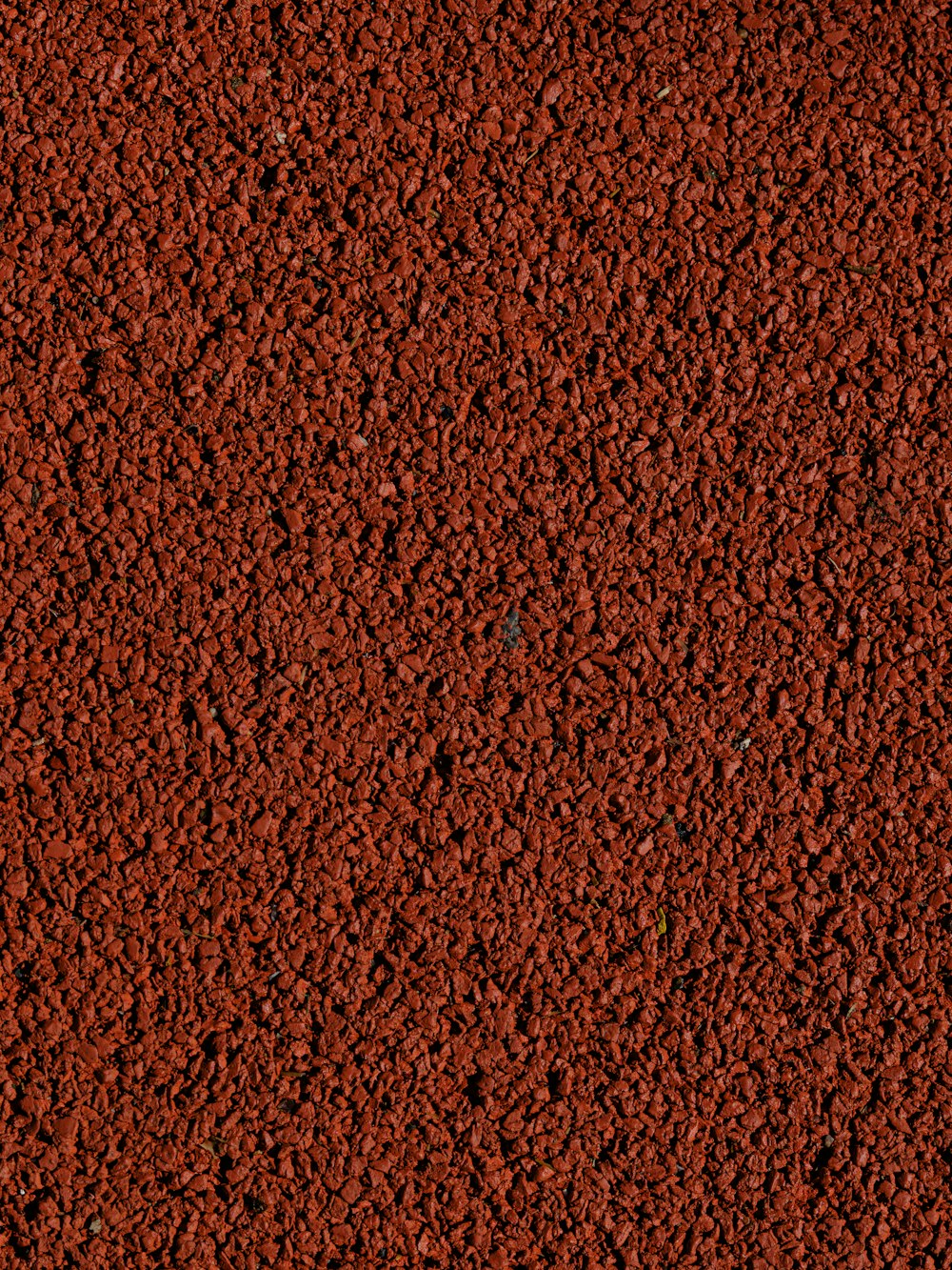 a close up of a red surface with a black border