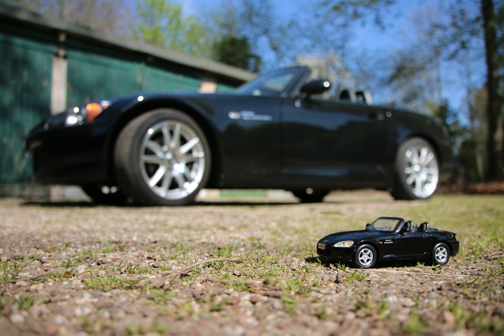 a toy car and a toy car on the ground