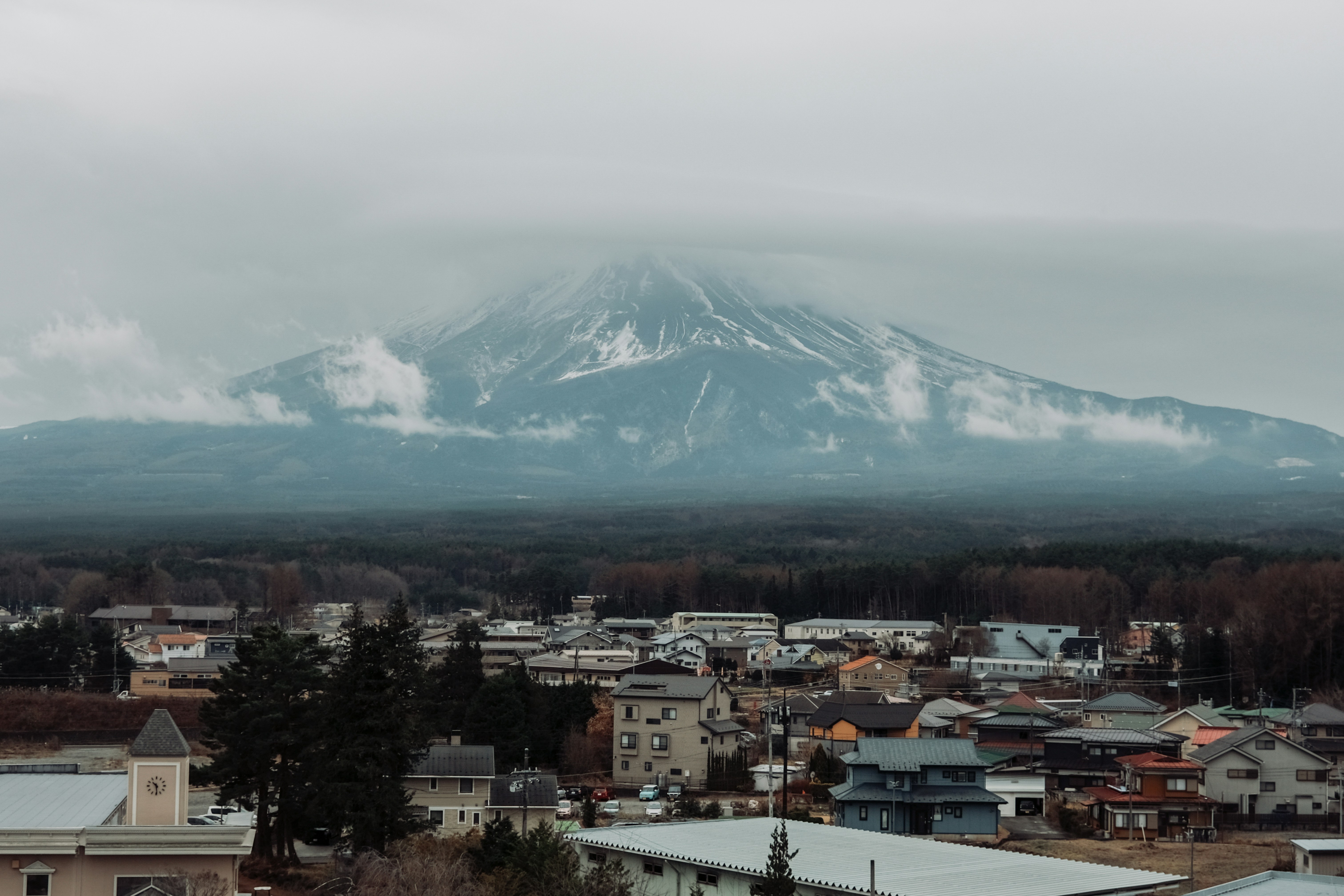 a view of a city with a mountain in the background